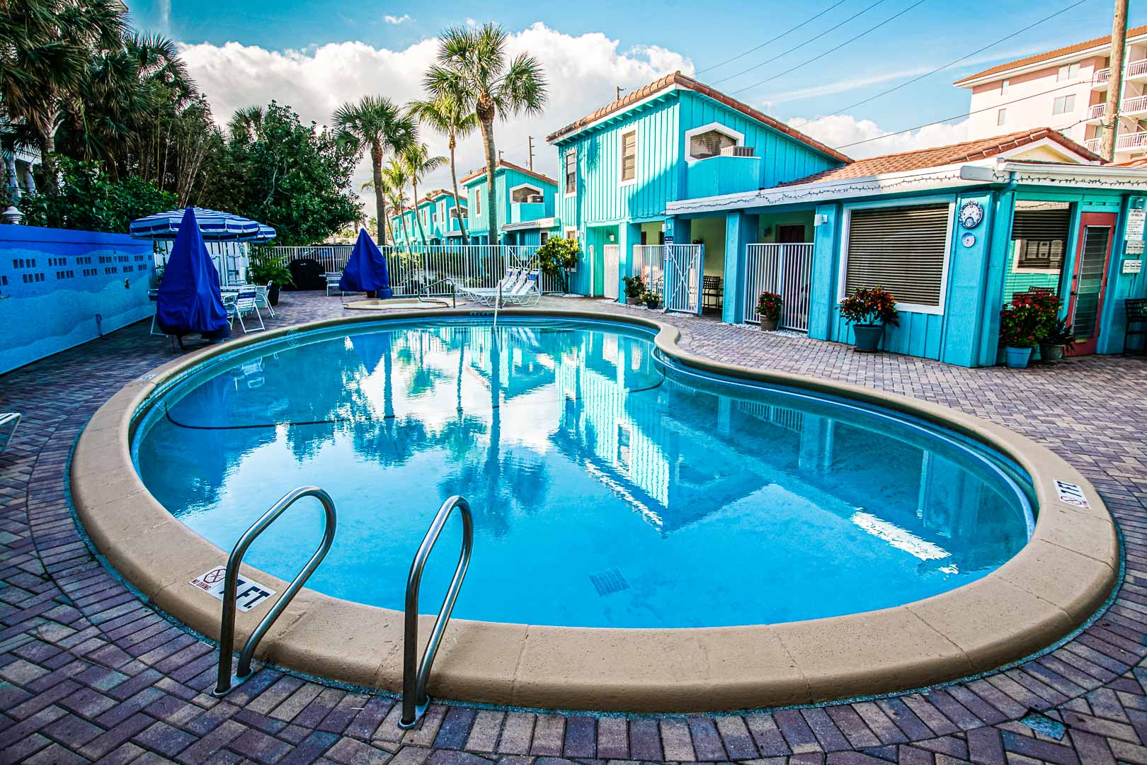 A relaxing swimming pool at VRI's Sand Dune Shores in Florida.